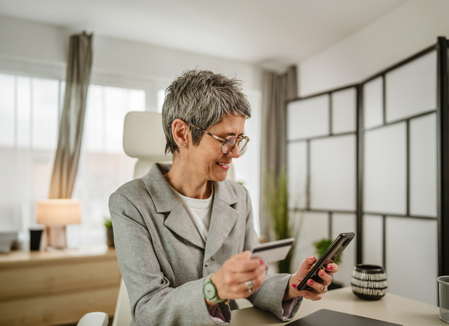 Older woman credit card shopping