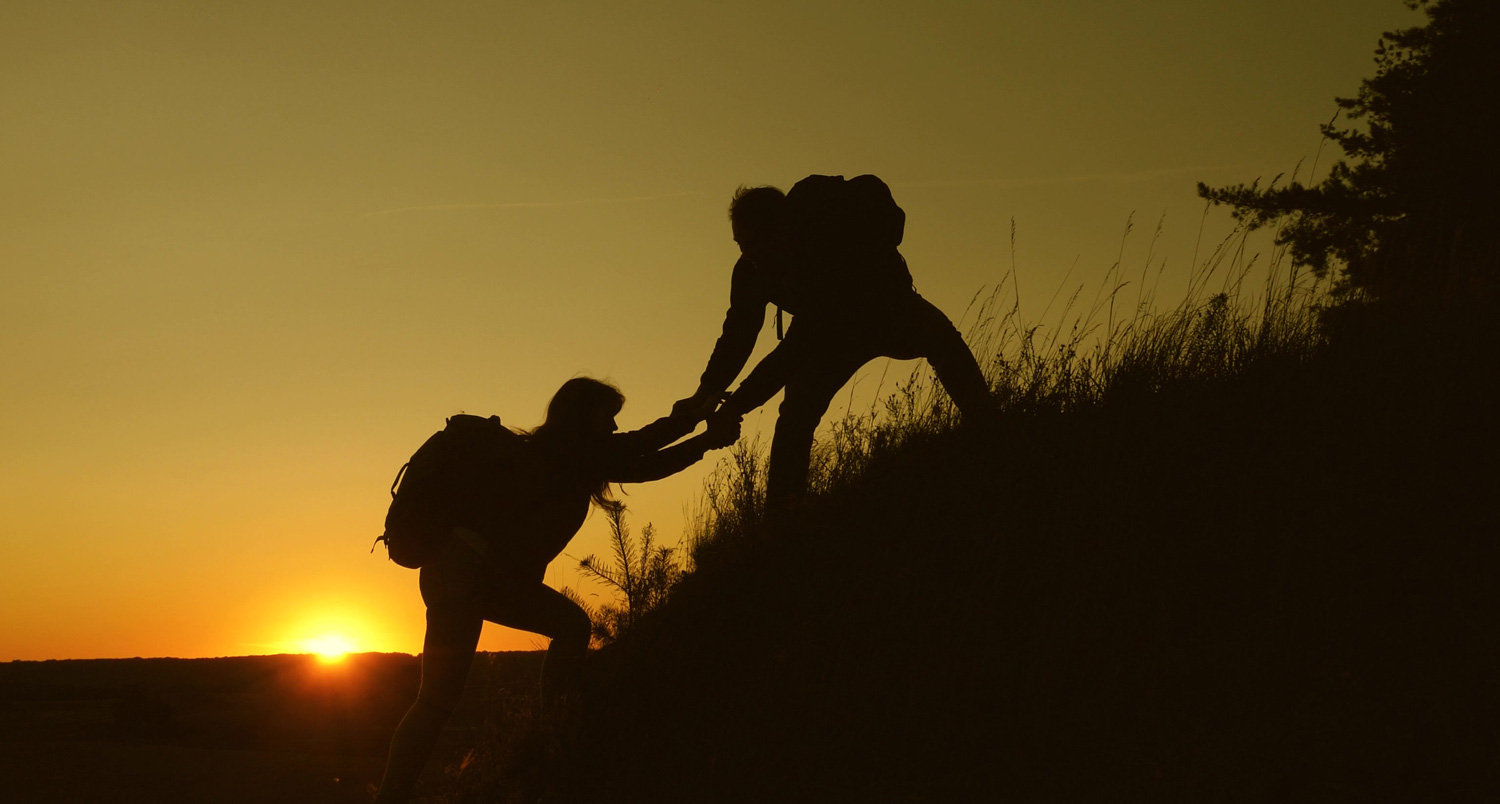 Teamwork silhouette climbing