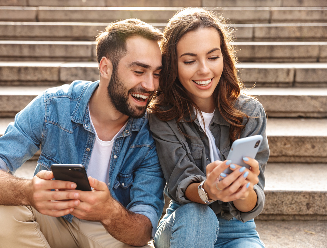 white couple sitting on steps