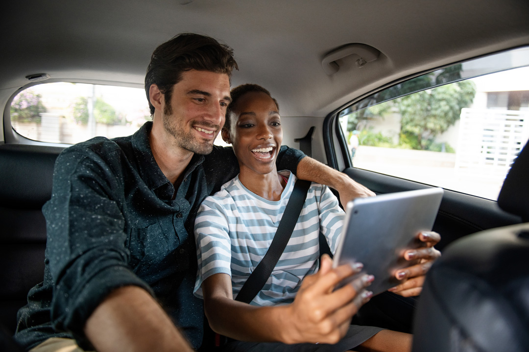 interacial-couple-in-car-on-ipad_250345945